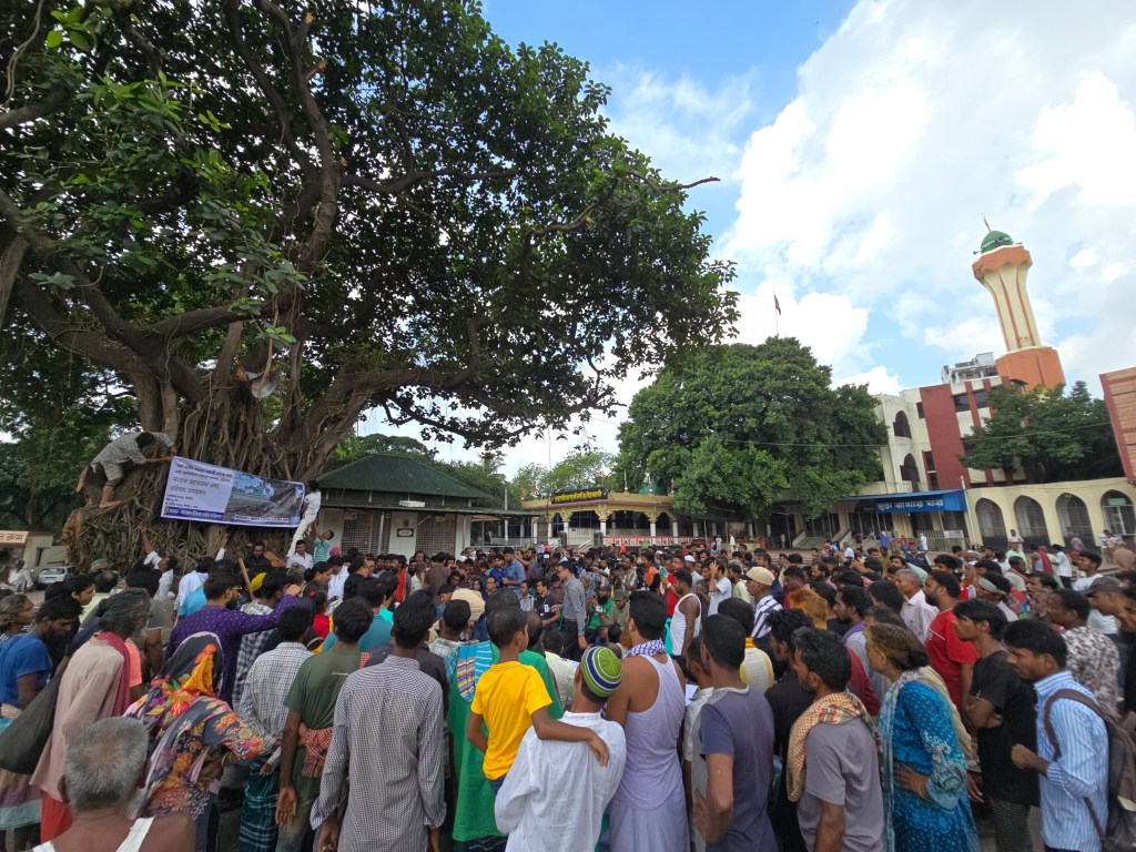 Devotees, bauls, faqirs, and poets gather at the shrine of Hazrat Shah Ali Baghdadi (R.A.) in Mirpur to protest the pruning of an ancient banyan tree, calling it an attack on communal spiritual space. October 4, 2025. Photo: Sharif Khiam Ahmed