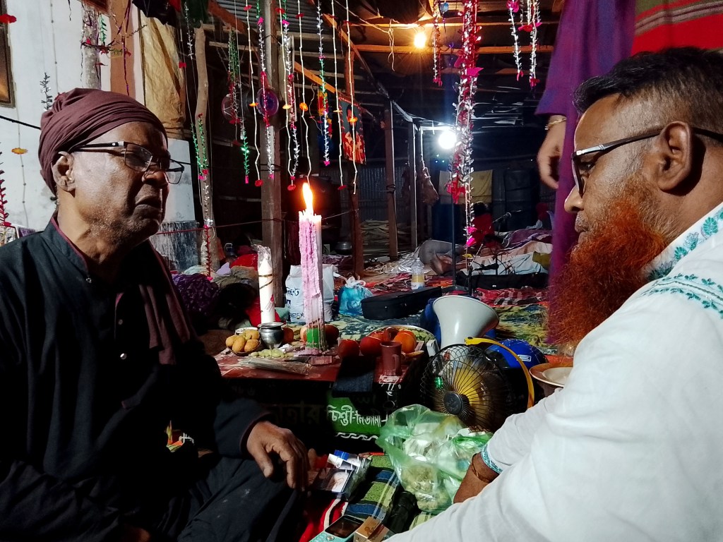 Filmmaker Mahbub Hossen captured this moment of a conversation between a mentor and his disciple at the Solaiman Lengta Fair. April 1, 2026.